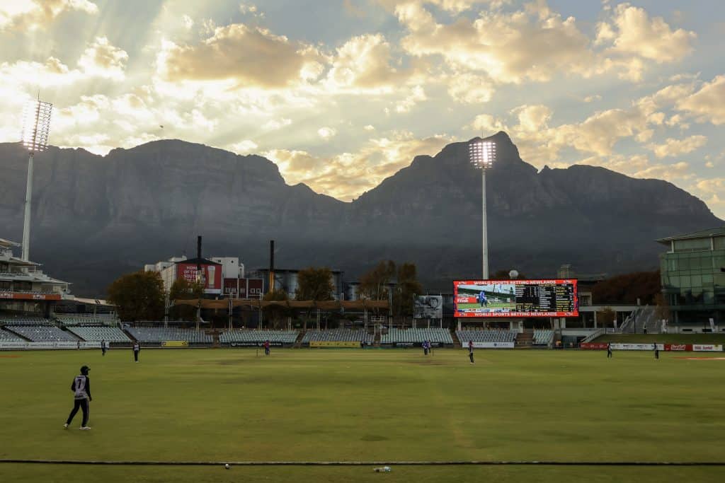 Newlands Cricket Ground below Table Mountain and Devil's Peak under dramatic storm light — The Property Bureau rental agent in Newlands