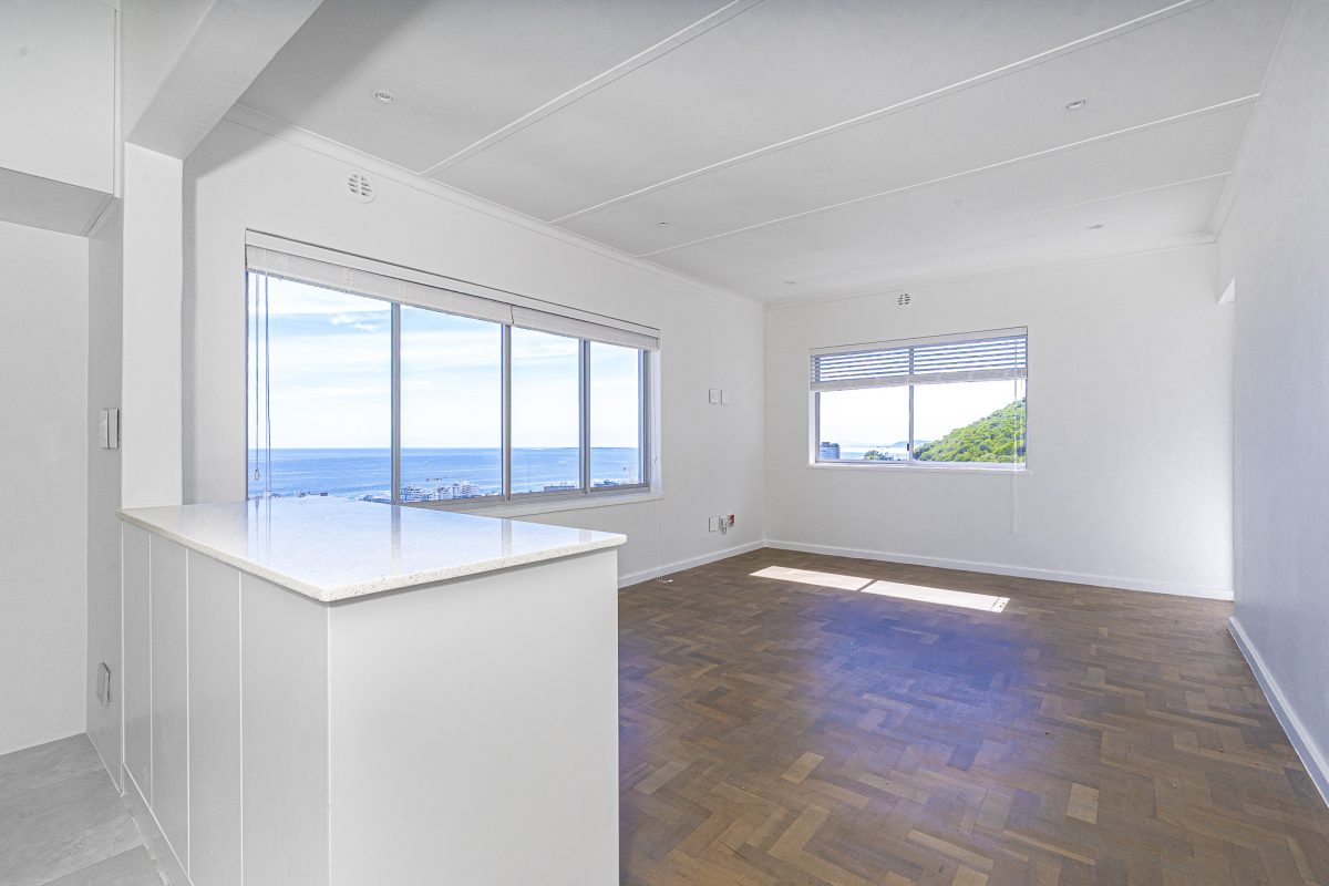 Renovated two bedroom apartment with sweeping sea views, garage and parking bay