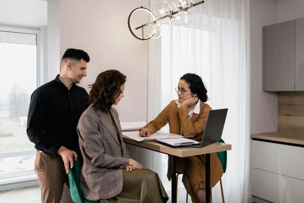 Property agent meeting a prospective tenant in person at a viewing
